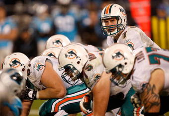 CHARLOTTE, NC - NOVEMBER 19:  Chad Henne #7 of the Miami Dolphins looks down the line of scrimmage against the Carolina Panthers during their game at Bank of America Stadium on November 19, 2009 in Charlotte, North Carolina.  (Photo by Streeter Lecka/Getty Images)