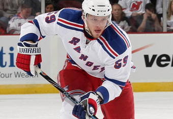 NEWARK, NJ - SEPTEMBER 16:  Evgeny Grachev #59 of the New York Rangers skates against the New Jersey Devils at the Prudential Center on September 16, 2009 in Newark, New Jersey. The Devils defeated the Rangers 3-2 in the shoot out.  (Photo by Bruce Bennett/Getty Images)
