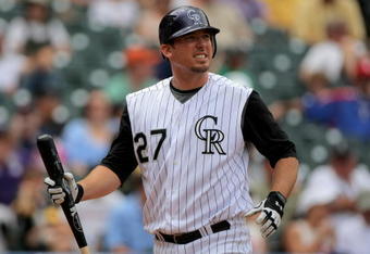 DENVER - MAY 31:  Garrett Atkins #27 of the Colorado Rockies heads to the dugout after striking out against the San Diego Padres during MLB action at Coors Field on May 31, 2009 in Denver, Colorado. The Padres defeated the Rockies 5-2.  (Photo by Doug Pensinger/Getty Images)