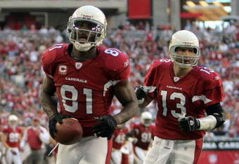 GLENDALE, AZ - DECEMBER 23:  Anquan Boldin #81 of the Arizona Cardinals celebrates his second touchdown of the game in front of Kurt Warner #13 for a 14-7 lead against the Atlanta Falcons during the second quarter at University of Phoenix Stadium on December 23, 2007 in Glendale, Arizona.  (Photo by Harry How/Getty Images)