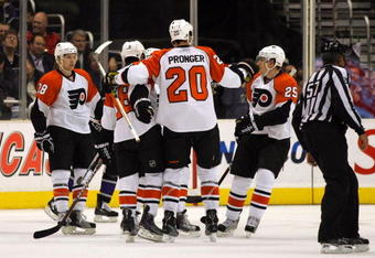 LOS ANGELES, CA - NOVEMBER 18:  Mike Richards #18 of the Philadelphia Flyers celebrates his second period goal against the Los Angeles Kings with teammates Chris Pronger #25, Claude Giroux #28 and Matt Carle #25 in the second period during the NHL game at the Staples Center on November 18, 2009 in Los Angeles, California.  (Photo by Victor Decolongon/Getty Images)
