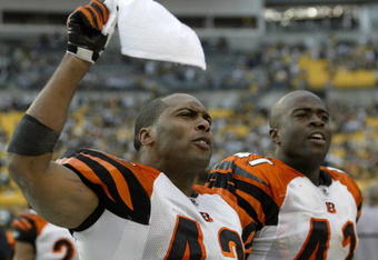 PITTSBURGH - NOVEMBER 15:  Chris Crocker #42 and Chinedum Ndukwe #41 of the Cincinnati Bengals celebrate in the bench area en route to an 18-12 win over the Pittsburgh Steelers during their game at Heinz Field on November 15, 2009 in Pittsburgh, Pennsylvania. The Bengals defeated the Steelers 18-12. (Photo by Rick Stewart/Getty Images)