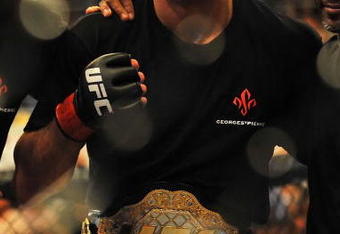 LAS VEGAS - JULY 11:  Georges St. Pierre celebrates his victory against Thiago Alves during their welterweight title bout during UFC 100 on July 11, 2009 in Las Vegas, Nevada. St. Pierre defeated Alves by unanimous decision.  (Photo by Jon Kopaloff/Getty Images)