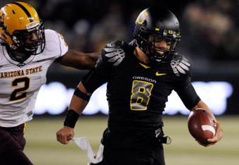EUGENE,OR - NOVEMBER 14: Quarterback Jeremiah Masoli #8 of the Oregon Ducks outruns safety Ryan McFoy #2 in the third quarter of the game at Autzen Stadium on November 14, 2009 in Eugene, Oregon. Oregon Defeated arizona State 44-21. (Photo by Steve Dykes/Getty Images)
