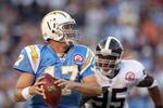 SAN DIEGO, CA - OCTOBER 19:  Quarterback Philip Rivers #17 of  the San Diego Chargers runs against the tackle of Darrell Reid #95 of the Denver Broncos during Monday Night Football on October 19, 2009 at Qualcomm Stadium in San Diego, California. (Photo by Donald Miralle/Getty Images)
