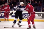 3 Mar 2001:  Stu Grimson #32 of the Los Angeles Kings gets into a fight with Darren McCarty #25 of the Detroit Red Wings during the game at the STAPLES Center in Los Angeles, California. The Kings defeated the Red Wings 6-3.Mandatory Credit: Kellie Landis  /Allsport