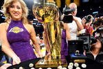LOS ANGELES, CA - OCTOBER 27:  A member of the Laker Girls poses with the Larry O'Brien championship trophy and rings to be presented to the Los Angeles Lakers before the season opening game against the Los Angeles Clippers at Staples Center on October 27, 2009 in Los Angeles, California.  NOTE TO USER: User expressly acknowledges and agrees that, by downloading and or using this photograph, User is consenting to the terms and conditions of the Getty Images License Agreement. Mandatory Copyright Notice: Copyright 2009 NBAE  (Photo by Kevork Djansezian/Getty Images)