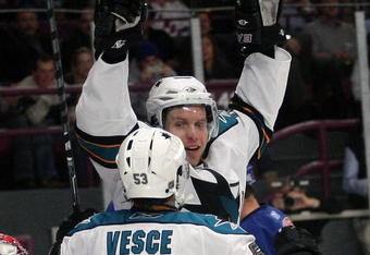 NEW YORK - OCTOBER 19: Dany Heatley #15 of the San Jose Sharks scores a first period goal against Steve Valiquette #40 of the New York Rangers and is joined by Ryan Vesce #53 at Madison Square Garden on October 19, 2009 in New York City.  (Photo by Bruce Bennett/Getty Images)