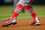 DENVER - SEPTEMBER 25:  A detail photograph of the shoes an sox of shortstop Brendan Ryan #13 of the St. Louis Cardinals as he leads off of first base against the Colorado Rockies at Coors Field on September 25, 2009 in Denver, Colorado. The Rockies defeated the Cardinals 2-1.  (Photo by Doug Pensinger/Getty Images)