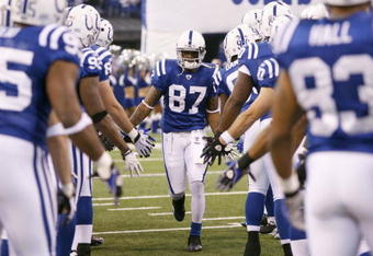 INDIANAPOLIS - DECEMBER 28:  Reggie Wayne #99 of the Indianapolis Colts greets teammates as he is introduced before the game against the Tennessee Titans on December 28, 2008 at Lucas Oil Stadium in Indianapolis, Indiana. (Photo by: Jamie Squire/Getty Images)