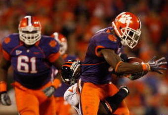 CLEMSON, SC - NOVEMBER 21:  The Virginia Cavaliers try to stop Jacoby Ford #6 of the Clemson Tigers during their game at Memorial Stadium on November 21, 2009 in Clemson, South Carolina.  (Photo by Streeter Lecka/Getty Images)