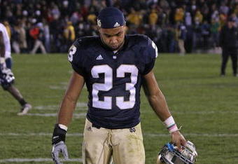 SOUTH BEND, IN - NOVEMBER 21: Golden Tate #23 of the Notre Dame Fighting Irish walks off the field after a loss to the Univeristy of Connecticut Huskies at Notre Dame Stadium on November 21, 2009 in South Bend, Indiana. Connecticut defeated Notre Dame 33-30 in overtime. (Photo by Jonathan Daniel/Getty Images)