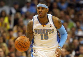 DENVER - MAY 29:  Carmelo Anthony #15 of the Denver Nuggets moves the ball in Game Six of the Western Conference Finals during the 2009 NBA Playoffs against the Los Angeles Lakers at Pepsi Center on May 29, 2009 in Denver, Colorado. NOTE TO USER: User expressly acknowledges and agrees that, by downloading and or using this photograph, User is consenting to the terms and conditions of the Getty Images License Agreement.  (Photo by Doug Pensinger/Getty Images)
