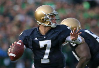 SOUTH BEND, IN - OCTOBER 17: Jimmy Clausen #7 of the Notre Dame Fighting Irish looks for a receiver against the USC Trojans at Notre Dame Stadium on October 17, 2009 in South Bend, Indiana. USC defeated Notre Dame 34-27. (Photo by Jonathan Daniel/Getty Images)
