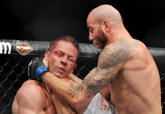 LAS VEGAS - NOVEMBER 21: Ben Saunders (R) battles Marcus Davis (L) during their Welterweight Fight at the UFC 106 at Mandalay Bay Events Center on November 21, 2009 in Las Vegas, Nevada. (Photo by Jon Kopaloff/Getty Images)