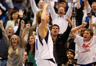 DALLAS - NOVEMBER 18:  Forward Dirk Nowitzki #41 of the Dallas Mavericks reacts after scoring in overtime against the San Antonio Spurs on November 18, 2009 at American Airlines Center in Dallas, Texas.  NOTE TO USER: User expressly acknowledges and agrees that, by downloading and/or using this Photograph, user is consenting to the terms and conditions of the Getty Images License Agreement.  (Photo by Ronald Martinez/Getty Images)