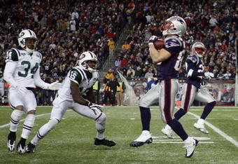 FOXBORO, MA - NOVEMBER 22:  Wes Welker #83 of the New England Patriots catches a punt as Wallace Wright #15 and Marquis Cole #34 of the New York Jets defend on November 22, 2009 at Gillette Stadium in Foxboro, Massachusetts.  (Photo by Elsa/Getty Images)