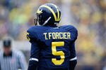 ANN ARBOR, MI - OCTOBER 24:  Tate Forcier #5 of the Michigan Wolverines looks on during the game against the Penn State Nittany Lions on October 24, 2009 at Michigan Stadium in Ann Arbor, Michigan. (Photo by  Gregory Shamus/Getty Images)