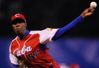 MEXICO CITY - MARCH 10:  Aroldis Chapman #52 of Cuba pitches against Australia during the first inning of the game during the 2009 World Baseball Classic Pool B match on March 10, 2009 at the Estadio Foro Sol in Mexico City, Mexico.  (Photo by Kevork Djansezian/Getty Images)