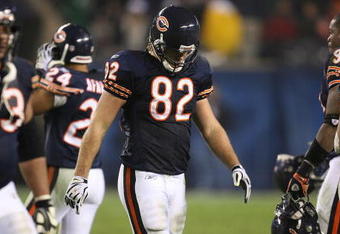 CHICAGO - NOVEMBER 22: Greg Olsen #82 of the Chicago Bears walks off the field with teammates at the end of the Bears' last offensive series against the Philadelphia Eagles at Soldier Field on November 22, 2009 in Chicago, Illinois. The Eagles defeated the Bears 24-20. (Photo by Jonathan Daniel/Getty Images)