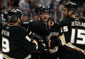 ANAHEIM, CA - NOVEMBER 03:  (L-R) Bobby Ryan #9, Corey Perry #10, Ryan Getzlaf #15  and Scott Niedermayer #27 of the Anaheim Ducks celebrate Perry's first-period goal against the Pittsburgh Penguins at the Honda Center on November 3, 2009 in Anaheim, California.  (Photo by Jeff Gross/Getty Images)