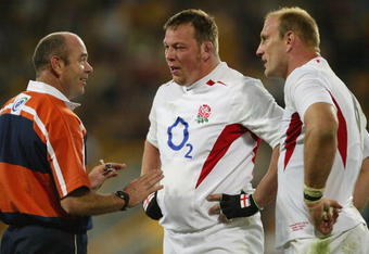 BRISBANE, AUSTRALIA - JUNE 26: (L-R) Referee Paddy O'Brien speaks with Steve Thompson and Lawrence Dallaglio of England during the rugby union international match between the Australian Wallabies and England for the Cook Cup at Suncorp Stadium June 26, 2004 in Brisbane, Australia. (Photo by Nick Laham/Getty Images)