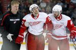 MONTREAL- NOVEMBER 21:  Niklas Kronwall #55 of the Detroit Red Wings is helped off of the ice after being tripped by Georges Laraque #17 of the Montreal Canadiens during the NHL game on November 21, 2009 at the Bell Centre in Montreal, Quebec, Canada.  (Photo by Richard Wolowicz/Getty Images)