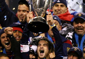 SEATTLE - NOVEMBER 22:  Kyle Beckerman #5 of Real Salt Lake holds the Philip F. Anschutz MLS Cup trophy as he and his teammates celebrate their win over the Los Angeles Galaxy in the MLS Cup final at Qwest Field on November 22, 2009 in Seattle, Washington. Real Salt Lake won 5-4 in a penalty shootout following regulation time.  (Photo by Otto Greule Jr/Getty Images)