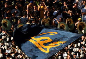 PASADENA, CA - OCTOBER 17:  A California Golden Bears cheerleader waves a flag in front of the Cal band and visitor's section in the game with the UCLA Bruins on October 17, 2009 at the Rose Bowl in Pasadena, California.   Cal won 45-26.  (Photo by Stephen Dunn/Getty Images)