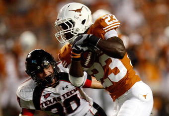 AUSTIN, TX - SEPTEMBER 19:  Running back Tre' Newton #23 of the Texas Longhorns runs for a touchdown against Brett Dewhurst #30 of the Texas Tech Red Raiders at Darrell K Royal-Texas Memorial Stadium on September 19, 2009 in Austin, Texas.  (Photo by Ronald Martinez/Getty Images)