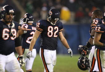 CHICAGO - NOVEMBER 22: Greg Olsen #82 of the Chicago Bears walks off the field with teammates at the end of the Bears' last offensive series against the Philadelphia Eagles at Soldier Field on November 22, 2009 in Chicago, Illinois. The Eagles defeated the Bears 24-20. (Photo by Jonathan Daniel/Getty Images)