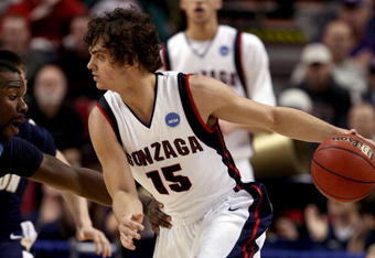 PORTLAND, OR - MARCH 19:  Matt Bouldin #15 of the Gonzaga Bulldogs drives on Darryl Roberts #12 of the Akron Zips in the second half during the first round of the NCAA Division I Men's Basketball Tournament at the Rose Garden on March 19, 2009 in Portland, Oregon.  (Photo by Jonathan Ferrey/Getty Images)