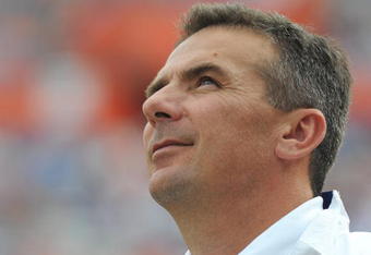 GAINESVILLE, FL - NOVEMBER 21: Coach Urban Meyer of the Florida Gators checks the scoreboard against the Florida International University Golden Panthers, November 21, 2009 at Ben Hill Griffin Stadium in Gainesville, Florida.  Florida won 62 - 3. (Photo by Al Messerschmidt/Getty Images)