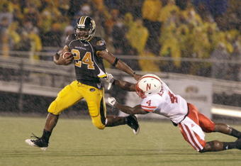 COLUMBIA, MO - OCTOBER 08:  Derrick Washington #2 of the Missouri Tigers carries the ball against Larry Asante #4 of the Nebraska Cornhuskers on October 8, 2009 at Faurot Field/Memorial Stadium in Columbia, Missouri. (Photo by Jamie Squire/Getty Images)