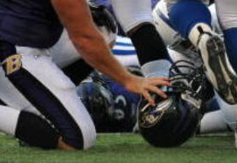 BALTIMORE - NOVEMBER 22:  Matt Birk #77 of the Baltimore Ravens collects his helmet after an unsuccessful goalline run against the Indianapolis Colts at M&T Bank Stadium on November 22, 2009 in Baltimore, Maryland. The Colts defeated the Ravens 17-15. (Photo by Larry French/Getty Images)