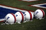 GAINESVILLE, FL - SEPTEMBER 30:  University of Florida Gators helmets from the middle 1960's sit on the field prior to a game againt the University of Alabama Crimson Tide at Ben Hill Griffin Stadium at Florida Field September 30, 2006 in Gainsville, Florida.  The Gators are celebrating 100 years of college football.  (Photo by Marc Serota/Getty Images)