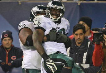 CHICAGO - NOVEMBER 22: LeSean McCoy #29 of the Philadelphia Eagles is lifted by teammate Nick Cole #59 after scoring the game-winning touchdown against the Chicago Bears at Soldier Field on November 22, 2009 in Chicago, Illinois. The Eagles defeated the Bears 24-20. (Photo by Jonathan Daniel/Getty Images)
