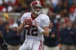 OXFORD, MS - OCTOBER 10:  Quarterback Greg McElroy #12 of the Alabama Crimson Tide looks for a receiver during their game against the Mississippi Rebels at Vaught-Hemingway Stadium on October 10, 2009 in Oxford, Mississippi. (Photo by Dave Martin/Getty Images)