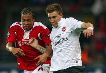 LIEGE, BELGIUM - SEPTEMBER 16:  Nicklas Bendtner of Arsenal battles with Moussa Traore of Standard Liege during the UEFA Champions League Group H match between Standard Liege and Arsenal at the Sclessin Stadium on September 16, 2009 in Liege, Belgium.  (Photo by Jamie McDonald/Getty Images)