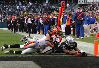 OAKLAND, CA - NOVEMBER 22:  Louis Murphy #18 of the Oakland Raiders catches a touchdown pass over Morgan Trent #25 of the Cincinnati Bengals in the fourth quarter to tie the gameduring an NFL game at Oakland-Alameda County Coliseum on November 22, 2009 in Oakland, California.  (Photo by Jed Jacobsohn/Getty Images)