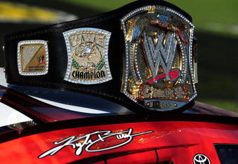 FORT WORTH, TX - NOVEMBER 07:  A replica of the WWE world championship belt rests on top of Kyle Busch's #18 Z-Line Designs/WWE Smackdown Toyota prior to the start of the NASCAR Nationwide Series O'Reilly Challenge at Texas Motor Speedway on November 7, 2009 in Fort Worth, Texas.  (Photo by Robert Laberge/Getty Images for NASCAR)