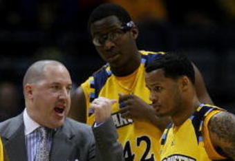 MILWAUKEE - JANUARY 24: Head coach Buzz Williams of the Marquette Golden Eagles gives instructions to Jerel McNeal #22, Chris Otule #42 and Dominic James #1 during a game against the DePaul Blue Demons on January 24, 2009 at the Bradley Center in Milwaukee, Wisconsin. Marquette defeated DePaul 79-70. (Photo by Jonathan Daniel/Getty Images)