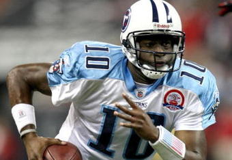 HOUSTON - NOVEMBER 23:  Quarterback Vince Young #10 of the Tennessee Titans runs with the ball against the Houston Texans on November 23, 2009  at Reliant Stadium in Houston, Texas.  (Photo by Stephen Dunn/Getty Images)