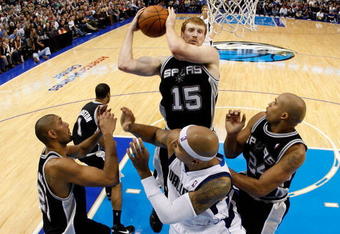 DALLAS - NOVEMBER 18:  Forward Matt Bonner #15 of the San Antonio Spurs grabs a rebound against the Dallas Mavericks on November 18, 2009 at American Airlines Center in Dallas, Texas.  NOTE TO USER: User expressly acknowledges and agrees that, by downloading and/or using this Photograph, user is consenting to the terms and conditions of the Getty Images License Agreement.  (Photo by Ronald Martinez/Getty Images)