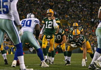 GREEN BAY, WI - NOVEMBER 15: Aaron Rodgers #12 of the Green Bay Packers walks up to the line scrimmage beofre calling a play against the Dallas Cowboys at Lambeau Field on November 15, 2009 in Green Bay, Wisconsin. The Packers defeated the Cowboys 17-7. (Photo by Jonathan Daniel/Getty Images)