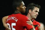 MANCHESTER, ENGLAND - NOVEMBER 21:  Antonio Valencia of Manchester United is congratulated by team mate Michael Owen after scoring his team's third goal during the Barclays Premier League match between Manchester United and Everton at Old Trafford on November 21, 2009 in Manchester, England.  (Photo by Alex Livesey/Getty Images)
