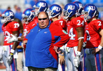 LAWRENCE, KS - SEPTEMBER 26:  Head coach Mark Mangino of the Kansas Jayhawks watches during warm-ups just prior to the start of the game against the Southern Mississippi Golden Eagles on September 26, 2009 at Memorial Stadium in Lawrence, Kansas.  (Photo by Jamie Squire/Getty Images)