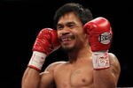 LAS VEGAS - NOVEMBER 14:  Manny Pacquiao smiles before taking on Miguel Cotto during their WBO welterweight title fight at the MGM Grand Garden Arena on November 14, 2009 in Las Vegas, Nevada.  (Photo by Al Bello/Getty Images)