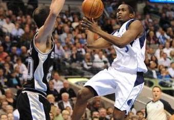 DALLAS - NOVEMBER 18:  Rodrigue Beaubois #3 of the Dallas Mavericks takes the ball to the basket against Manu Ginobili #20 of the San Antonio Spurs during the game at American Airlines Center on November 18, 2009 in Dallas, Texas. NOTE TO USER: User expressly acknowledges and agrees that, by downloading and or using this photograph, User is consenting to the terms and conditions of the Getty Images License Agreement. (Photo by Ronald Martinez/Getty Images)