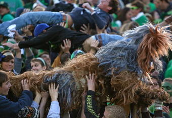 SOUTH BEND, IN - OCTOBER 17: Student fans of the Notre Dame Fighting Irish, including one in a Star Wars 'Wookie' costume, celebrate a touchdown against the USC Trojans at Notre Dame Stadium on October 17, 2009 in South Bend, Indiana. USC defeated Notre Dame 34-27. (Photo by Jonathan Daniel/Getty Images)
